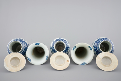A Chinese bleu de Hue porcelain five piece garniture with acrobats, 19th C