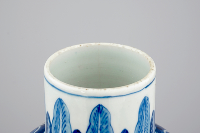 A Chinese bleu de Hue porcelain five piece garniture with acrobats, 19th C