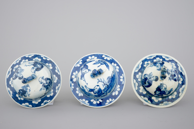 A Chinese bleu de Hue porcelain five piece garniture with acrobats, 19th C