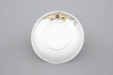 A Chinese grisaille and gilt export porcelain armorial cup and saucer, 18th C
