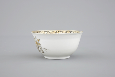 A Chinese grisaille and gilt export porcelain armorial cup and saucer, 18th C