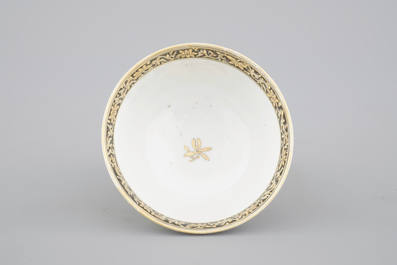 A Chinese grisaille and gilt export porcelain armorial cup and saucer, 18th C