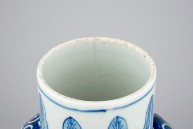 A Chinese bleu de Hue porcelain five piece garniture with acrobats, 19th C