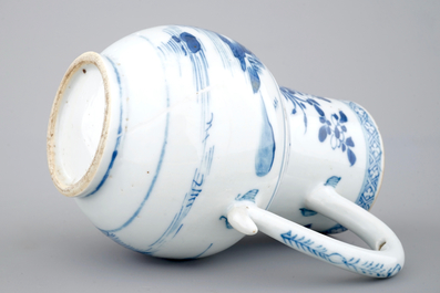 A Chinese blue and white jug with figures in a landscape, 18th C.