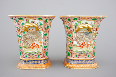 A pair of Chinese famille rose relief-decorated export porcelain bough pots, Qianlong, 18th C.