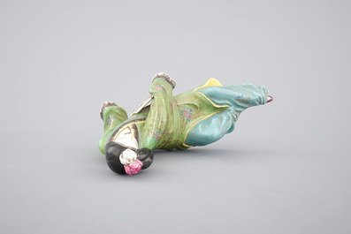 A Chinese famille rose porcelain figure of a reclining lady, 20th C