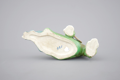 A Chinese famille rose porcelain figure of a reclining lady, 20th C