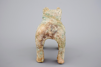 A Chinese green glazed pottery figure of a dog, presumably Han Dynasty