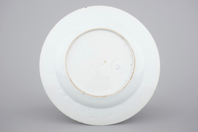 A Chinese famille rose porcelain plate with ladies in a garden, Yongzheng, 1722-1735