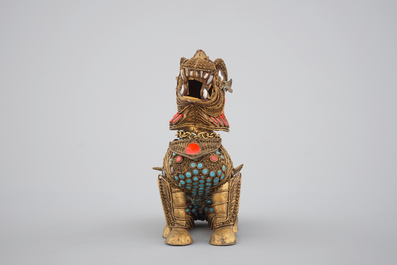 A Chinese or Sino-Tibetan filigree brass, turquoise and coral incense burner in the shape of a foo dog, 20th C.