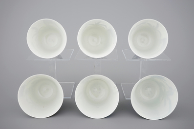A set of six Japanese blue and white wine cups and saucers, 18/19th C.