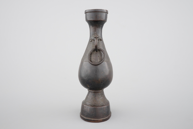 A Chinese bronze elongated bottle-shaped vase, Ming Dynasty