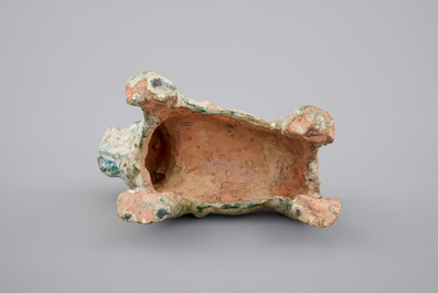 A Chinese green glazed pottery figure of a dog, presumably Han Dynasty
