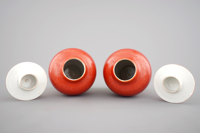 A pair of Chinese monochrome coral ground baluster vases with cover, 19th C.