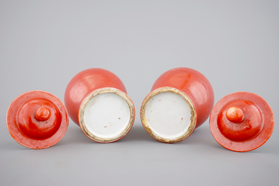 A pair of Chinese monochrome coral ground baluster vases with cover, 19th C.