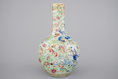 A Chinese celadon-ground blue and white porcelain bottle-shaped vase with Cantonese overdecoration, 19th C.