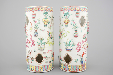 A pair of Chinese famille rose porcelain relief-moulded hat stands, 19th C.