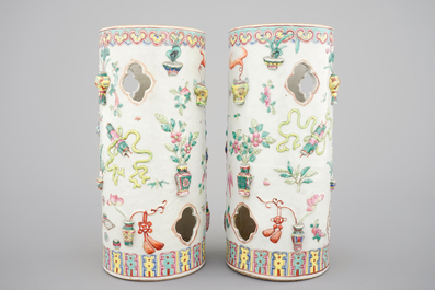 A pair of Chinese famille rose porcelain relief-moulded hat stands, 19th C.