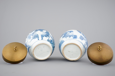 A pair of blue and white Japanese porcelain vases with brass covers in Chinese transitional style, Edo, 17th C.