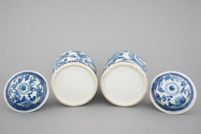 A pair of blue and white Chinese porcelain dragon vases and covers, 19th C.