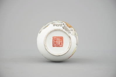 A tall Chinese porcelain famille rose vase with a figural scene and a small Qianjiang type vase, 19th C.