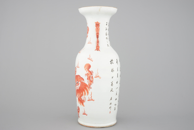 A tall Chinese iron-red porcelain vase with foo dogs, 19th C.