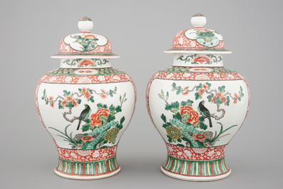 A pair of Chinese famille verte porcelain baluster vases and covers, 19th C.