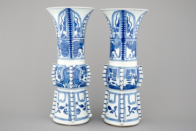An unusual pair of tall Chinese blue and white porcelain gu-shaped vases, Kangxi, ca. 1700