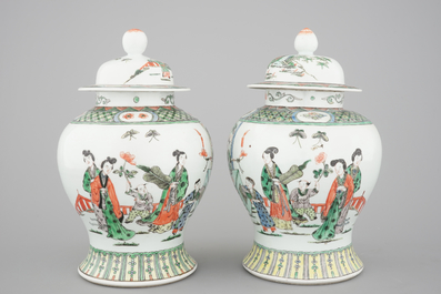 A pair of Chinese famille verte porcelain baluster vases and covers, 19th C.