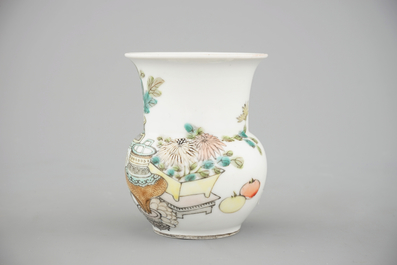 A tall Chinese porcelain famille rose vase with a figural scene and a small Qianjiang type vase, 19th C.