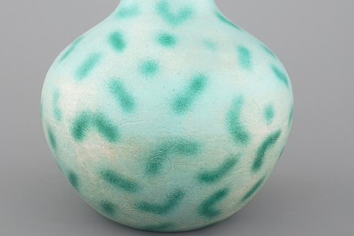 A rare Chinese green-spotted porcelain tianqu ping vase with anhua design of fighting dragons, 19th C.