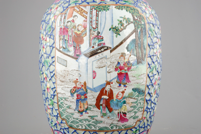 A massive pair of Chinese relief-decorated famille rose porcelain vases, 19th C.