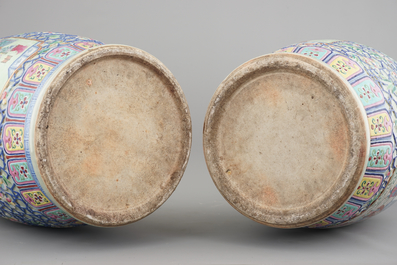 A massive pair of Chinese relief-decorated famille rose porcelain vases, 19th C.