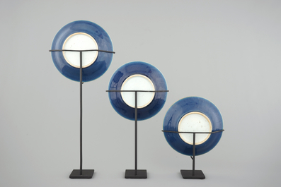 A set of 3 Chinese monochrome sacrificial blue plates on modern metal stands, 19th C.