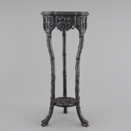 An intricately carved Chinese hardwood marble top vase stand, 19th C.