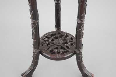 An intricately carved Chinese hardwood marble top vase stand, 19th C.