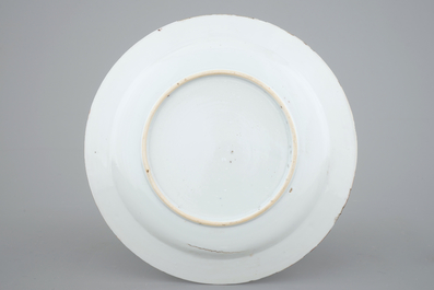 A fine Dutch-decorated armorial blanc de Chine plate, 18th C.