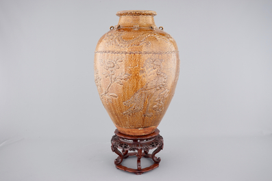 A large Martaban on a carved hardwood stand, 18/19th C.