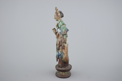 A tall Chinese sancai pottery figure of a guanyin, 18/19th C.