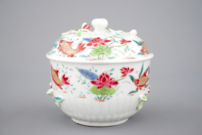 A Chinese famille rose and relief box and cover and two saucers with fish, Yongzheng, 1722-1735