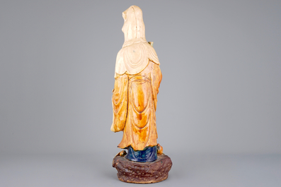 A tall Chinese sancai pottery figure of a guanyin, prob. Ming Dynasty