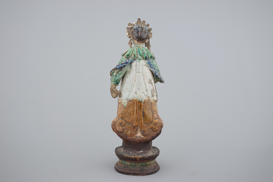 A tall Chinese sancai pottery figure of a guanyin, 18/19th C.