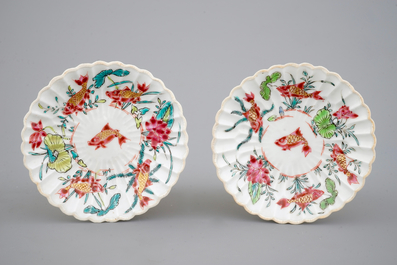 A Chinese famille rose and relief box and cover and two saucers with fish, Yongzheng, 1722-1735