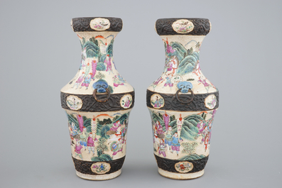 A pair of Chinese Nanking famille rose vases with warrior scenes, 19th C.