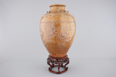 A large Martaban on a carved hardwood stand, 18/19th C.