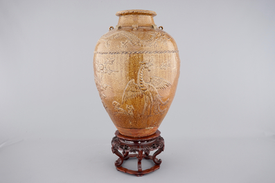 A large Martaban on a carved hardwood stand, 18/19th C.