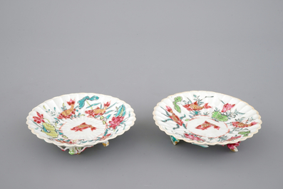 A Chinese famille rose and relief box and cover and two saucers with fish, Yongzheng, 1722-1735
