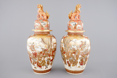 A very tall pair of Japanese Satsuma vases and covers, 19th C.
