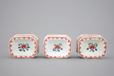 Three Chinese porcelain famille rose salts and five small plates, 18th C.