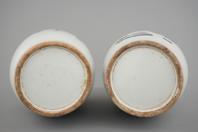 A tall pair of Chinese famille rose vases with beauties in a garden, 19th C.